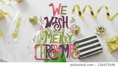 Image of we wish you a merry christmas text over christmas decorations on white background 126437046