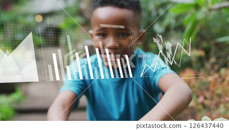 Image of financial data processing over african american boy planting plant 126437440