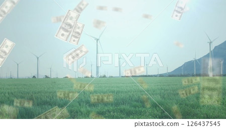 Wind turbines in green field with falling money image Wind turbines in green field with falling money image 126437545