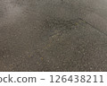 Puddles in depressions on asphalt roads 126438211