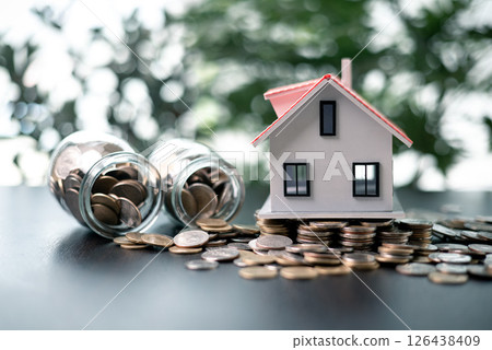 Securing a loan to finance the purchase of a property, the entrepreneur invested in real estate to grow their business using the house as both a home and a valuable asset under a mortgage agreement. Securing a loan to finance the purchase of a property, the entrepreneur invested in real estate to grow their business using the house as both a home and a valuable asset under a mortgage agreement. 126438409