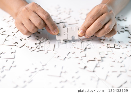 Developing strategic approach to each challenge in business is like piecing together jigsaw puzzle, solution fits into place with careful planning and steady hand, ultimately leading to success. 126438569