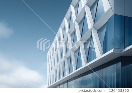 Modern White and Blue Geometric Building Exterior Under a Clear Sky 126438860