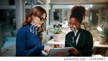 Happy women, designers or night with tablet for research, project or development at office. Female people, employees or colleagues working late with smile on technology for business idea at workplace 126438952