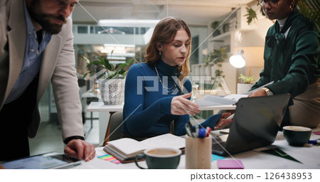 Business people, paper and meeting in office for discussion, project feedback or advice at night. Journalist team, document and tech in agency for article planning, collaboration and late information Business people, paper and meeting in office for discussion, project feedback or advice at night. Journalist team, document and tech in agency for article planning, collaboration and late information 126438953