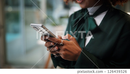 Business woman, cellphone and hands typing in office for communication, contact or fashion inspiration. Female designer, tech and scroll for design feedback, social media and search on internet 126439326