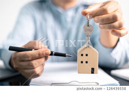 Real estate agent helped the client secure a mortgage loan for their property investment, ensuring the contract was properly handled by the broker. investment, property, estate, loan, real, mortgage. 126439338