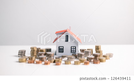 Investment in a home often involves securing a mortgage loan, with a finance agent helping to manage business and property aspects of the house to ensure best use of your money. investment, loan. Investment in a home often involves securing a mortgage loan, with a finance agent helping to manage business and property aspects of the house to ensure best use of your money. investment, loan. 126439411