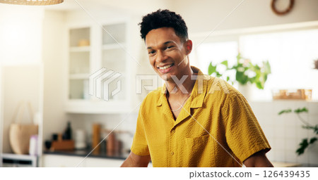 Confidence, kitchen and portrait of happy man in home with chef skills and practice for cooking. Satisfaction, smile and proud male person in Colombia with positive attitude in apartment for baking 126439435