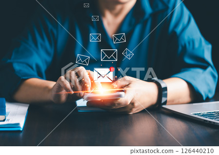 Businesses send electronic mail and newsletters to clients as part of their online marketing strategy, delivering messages through various platforms like social media and phone. electronic mail. Businesses send electronic mail and newsletters to clients as part of their online marketing strategy, delivering messages through various platforms like social media and phone. electronic mail. 126440210