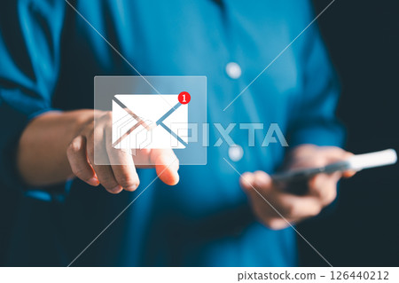 Businesses send electronic mail and newsletters to clients as part of their online marketing strategy, delivering messages through various platforms like social media and phone. electronic mail. 126440212
