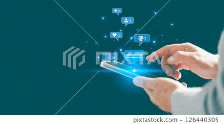 Person using smartphone taps on social media icon, initiating chat and communication within their network. chat, social, communication, icon, media, message, Concept central to modern messaging. 126440305