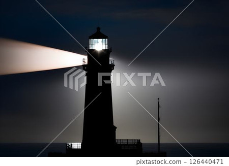 Beam of Lighthouse Through Dark Sky 126440471