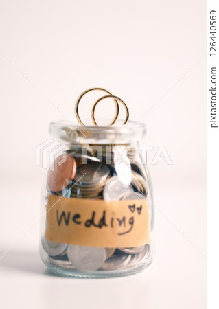 Woman carefully manages her wedding fund, making payments from her bank account and using credit wisely, with the background of sound financial plan supporting her marriage and business commitments. Woman carefully manages her wedding fund, making payments from her bank account and using credit wisely, with the background of sound financial plan supporting her marriage and business commitments. 126440569