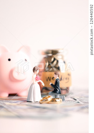 Couple invested their money in gold jewelry and managed their wedding finances carefully, using their wealth and cash savings to celebrate their engagement in style. money, couple, wedding, cash. Couple invested their money in gold jewelry and managed their wedding finances carefully, using their wealth and cash savings to celebrate their engagement in style. money, couple, wedding, cash. 126440592