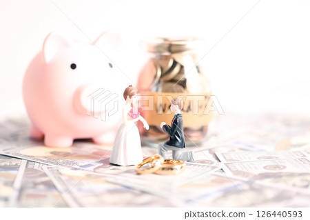 Couple invested their money in gold jewelry and managed their wedding finances carefully, using their wealth and cash savings to celebrate their engagement in style. money, couple, wedding, cash. Couple invested their money in gold jewelry and managed their wedding finances carefully, using their wealth and cash savings to celebrate their engagement in style. money, couple, wedding, cash. 126440593