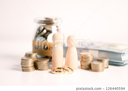 Couple invested their money in gold jewelry and managed their wedding finances carefully, using their wealth and cash savings to celebrate their engagement in style. money, couple, wedding, cash. Couple invested their money in gold jewelry and managed their wedding finances carefully, using their wealth and cash savings to celebrate their engagement in style. money, couple, wedding, cash. 126440594