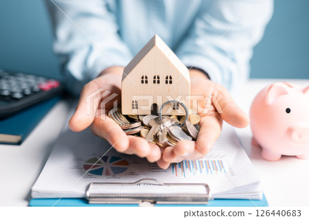 Woman decided to save money for house by managing her finances wisely and viewing her home as crucial investment in her future business endeavors. woman, save, money, house, finance, home, saving. 126440683