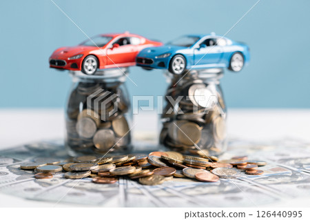 Buy a car, save money and consider the total fiscal value, market worth, and insurance costs. car, money, save, insurance, buy, fiscal, worth, market, total, value, concept. 126440995