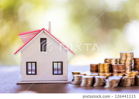 Saving money for a home is a crucial financial investment that can strengthen both personal finance and the economy. save, money, home, finance, financial, investment, saving, business, coin, house. 126441115