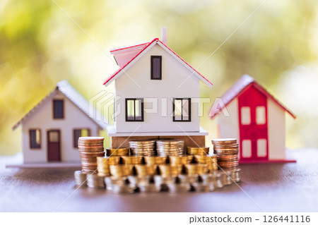 Saving money for a home is a crucial financial investment that can strengthen both personal finance and the economy. save, money, home, finance, financial, investment, saving, business, coin, house. 126441116