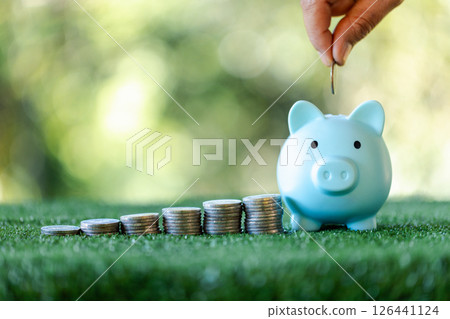 Concept of saving money is central to business and finance, with coins and currency representing investment and economic growth in a strong banking background. money, background, business, save. Concept of saving money is central to business and finance, with coins and currency representing investment and economic growth in a strong banking background. money, background, business, save. 126441124