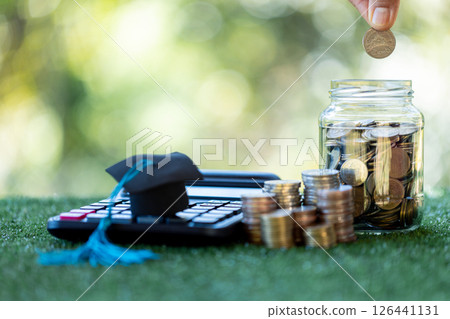 Saving for education is wise financial investment, with college funds and banking strategies helping to ensure financial growth by time of graduation. save, education, coin, banking, college, finance Saving for education is wise financial investment, with college funds and banking strategies helping to ensure financial growth by time of graduation. save, education, coin, banking, college, finance 126441131