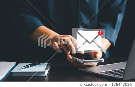 Client received an electronic mail containing a marketing message, seamlessly delivered through cyberspace in vast online web. electronic mail, cyberspace, client, letter, mail, marketing, message. 126442026