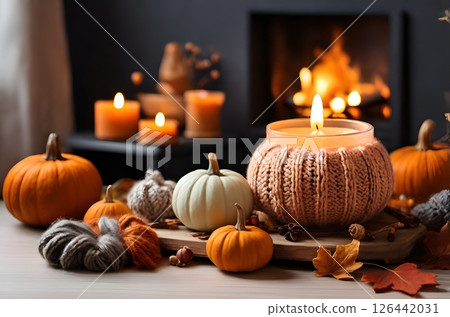 cozy autumn oasis, where the air is filled with the sweet fragrance of pumpkin pie and the gentle flicker of burning candles. 126442031