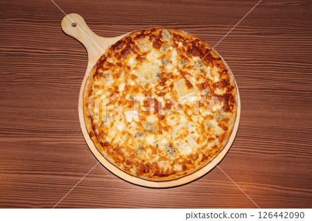 Cheese pizza on wooden background 126442090