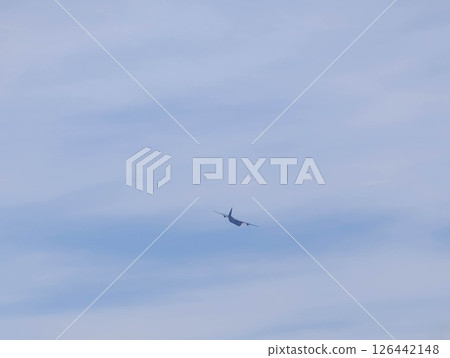 A propeller plane flies away with a roar 126442148
