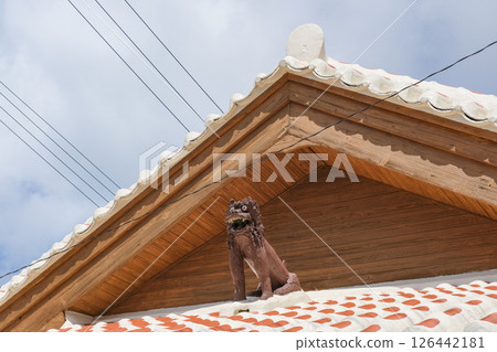 Okinawa's traditional red tile rooftop Shisa statue Okinawa's traditional red tile rooftop Shisa statue 126442181