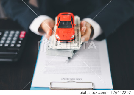 Concept business vehicle finance protection office plan investment buy sell car ensuring idea financial security. automobile agent hand protect purchase insurance and secure favorable loan deal. 126442207