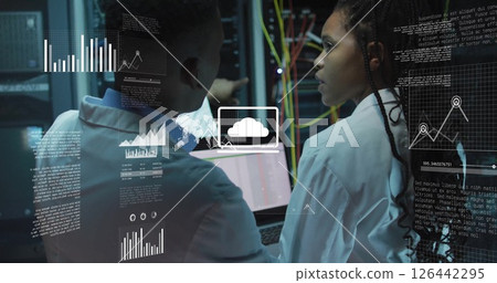 Image of data processing and diagrams over biracial workers using laptop in server room 126442295