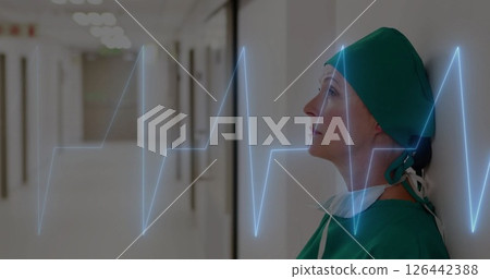 Image of cardiograph over caucasian female doctor sitting Image of cardiograph over caucasian female doctor sitting 126442388