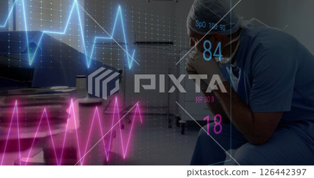 Image of cardiograph over sad caucasian male doctor sitting Image of cardiograph over sad caucasian male doctor sitting 126442397