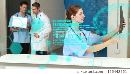Image of data processing over caucasian doctors talking and checking xray 126442561