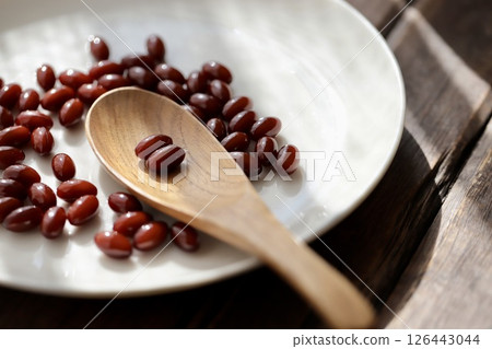 A brown pill supplement that you take two tablets at a time A brown pill supplement that you take two tablets at a time 126443044