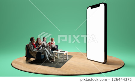 Family in pajamas watches 3D render of giant smartphone screen with blank display in suspenseful silence. Composite image. Collage. 126444375
