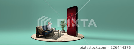 Stressed woman grabs head watching phone screen with red market candlestick charts showing decline. Composite image. Collage. Concept of finance, economic loss, trading, anxiety, digital world. 126444376