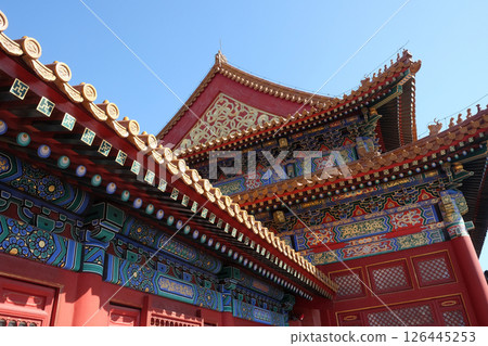 Tiled roof and facade decorated with a Chinese pattern. Palace in The Forbidden City, Beijing. 126445253