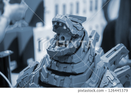 Detailed Art object printed on 3D printer. Robot toy created on 3D printer. Blue color. High-precision 3D printing technologies. Creation of three-dimensional models. Modern new innovative technology. 126445379
