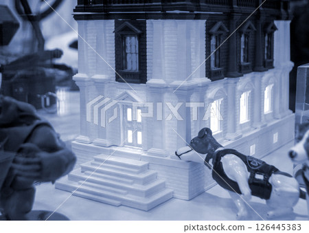 Prototype printed on 3D printer brick building with columns and glowing windows. Model of building with white and blue color, windows, created by 3D printer from molten plastic. Blue color Prototype printed on 3D printer brick building with columns and glowing windows. Model of building with white and blue color, windows, created by 3D printer from molten plastic. Blue color 126445383