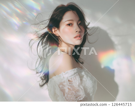Feminine female portrait with rainbow prism light in studio 126445715