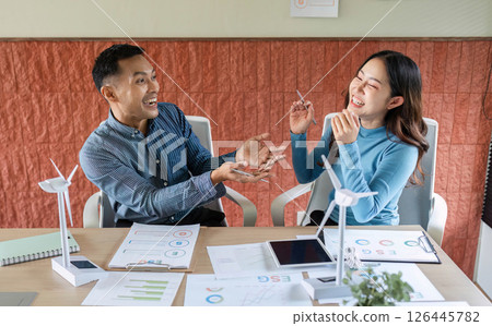 ESG Business Discussion. Two professionals engaging in a lively conversation about sustainable practices. ESG Business Discussion. Two professionals engaging in a lively conversation about sustainable practices. 126445782