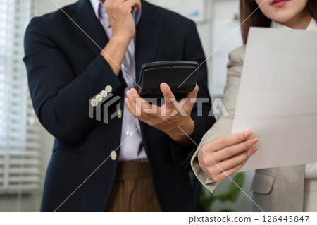 Business Consultation and Financial Planning. Professional discussing strategy with a client. 126445847