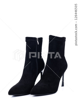 Black women's high-heeled ankle boots isolated on a white background. Women's classic, spring, autumn boots. Black women's high-heeled ankle boots isolated on a white background. Women's classic, spring, autumn boots. 126446505