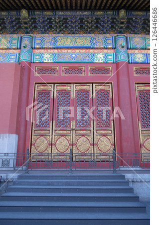 An ornate painted door on a building in the Forbidden City in Beijing An ornate painted door on a building in the Forbidden City in Beijing 126446686