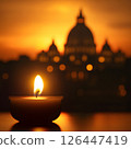 Vatican City, burning candle late at night with St. Peter's Basilica in the background, the death of the pope pontiff, grief and pain of loss 126447419