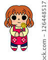 A mother wearing an apron holding a yellow carnation 126448517